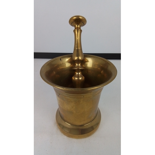 76 - Brass mortar and pestle—of flared cylindrical form with stepped foot and plain rim, the pestle with ... 