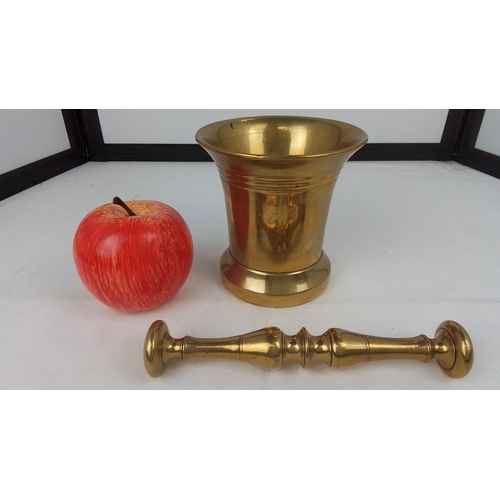 76 - Brass mortar and pestle—of flared cylindrical form with stepped foot and plain rim, the pestle with ... 
