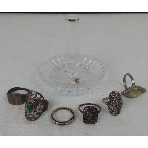 78 - A group of costume jewellery rings in silver-toned metal, including openwork settings with green cab... 