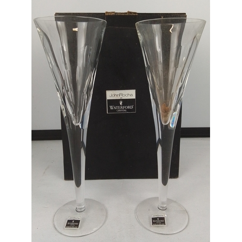 79 - John Rocha at Waterford Crystal—pair of Irish crystal fluted champagne flutes, the tapering bowls cu... 