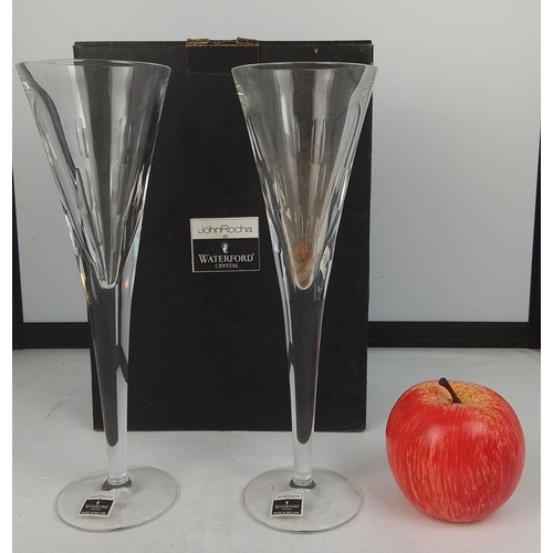 79 - John Rocha at Waterford Crystal—pair of Irish crystal fluted champagne flutes, the tapering bowls cu... 