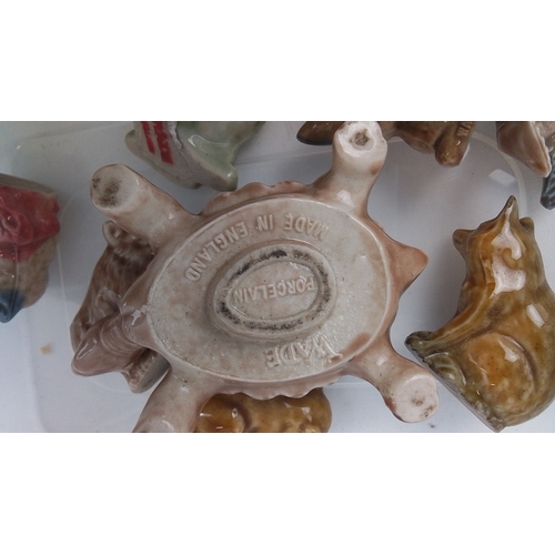 80 - A group of glazed porcelain animal miniatures, including a turtle, fawn, fox, squirrel, pig, frog an... 