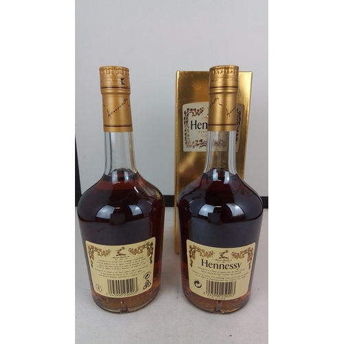 91 - A pair of Hennessy Very Special cognac bottles, 70cl, 40% vol., with gilt foil caps and printed labe... 