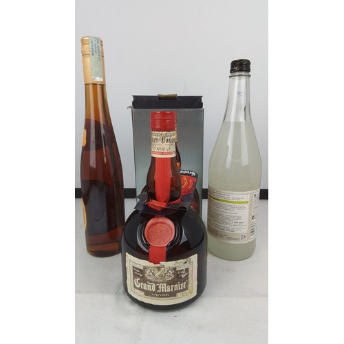 94 - A group of three bottles comprising Grand Marnier Cordon Rouge liqueur in presentation box, Gutes au... 