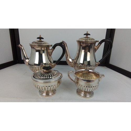 96 - A four-piece electroplated tea and coffee service by Walker & Hall, Sheffield, comprising coffee pot... 
