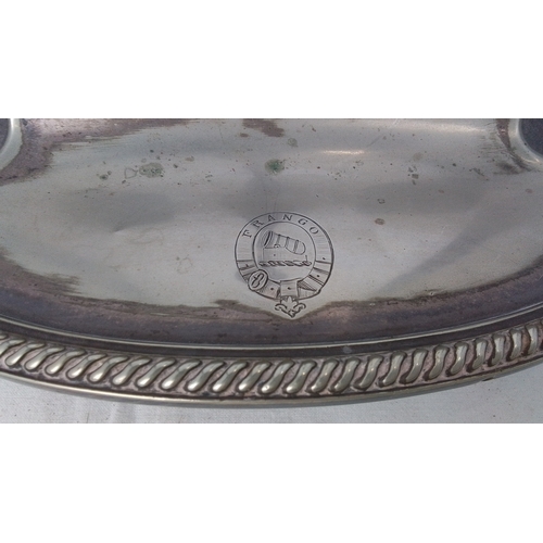 99 - Victorian silver-plated three-bottle decanter stand, of oval form with rope-twist rim, central balus... 