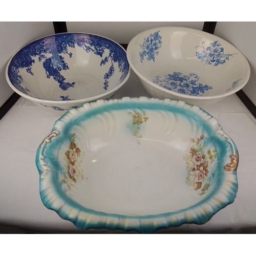 103 - A group of three transfer-printed earthenware basins, including two in blue floral patterns and an o... 