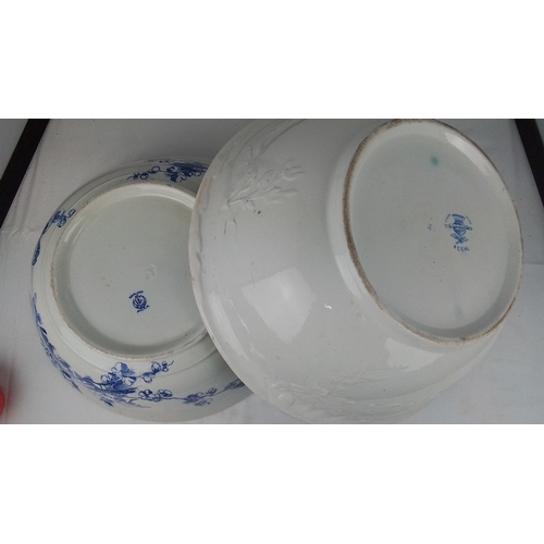 103 - A group of three transfer-printed earthenware basins, including two in blue floral patterns and an o... 
