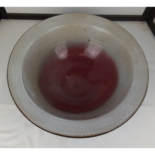 104 - Studio pottery stoneware bowl, the broad everted rim with speckled grey glaze, the interior with oxb... 