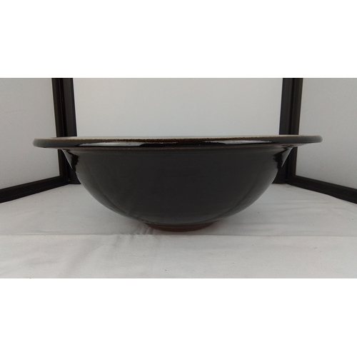 104 - Studio pottery stoneware bowl, the broad everted rim with speckled grey glaze, the interior with oxb... 
