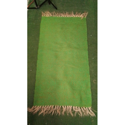 107 - Handwoven green wool runner with subtle variegated ground, finished at each end with cream tasseled ... 