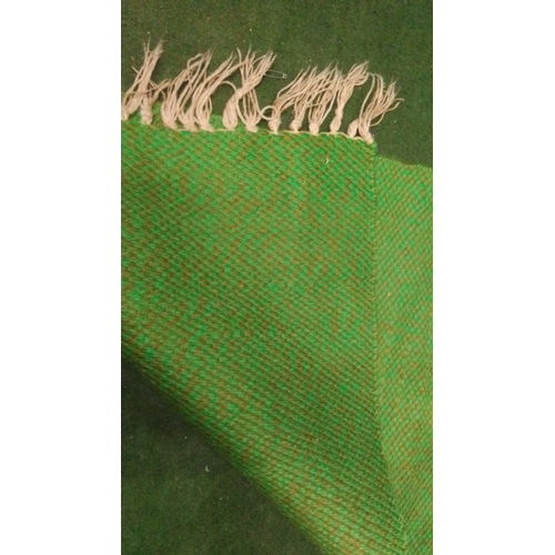 107 - Handwoven green wool runner with subtle variegated ground, finished at each end with cream tasseled ... 