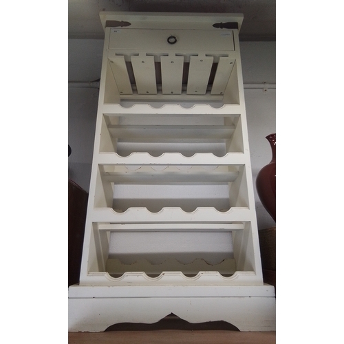 109 - Painted wood wall-hung plate rack, the cornice with strap-hinged lift-front compartment fitted with ... 
