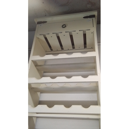 109 - Painted wood wall-hung plate rack, the cornice with strap-hinged lift-front compartment fitted with ... 