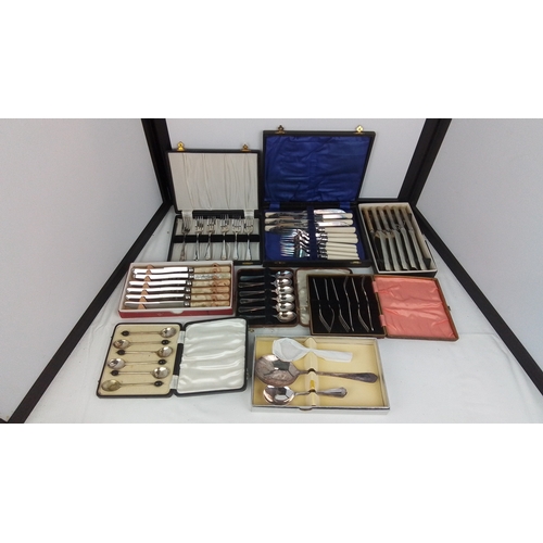 116 - A group of assorted cased flatware including fish knives and forks with ivory-coloured handles, moth... 