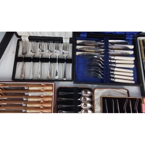 116 - A group of assorted cased flatware including fish knives and forks with ivory-coloured handles, moth... 