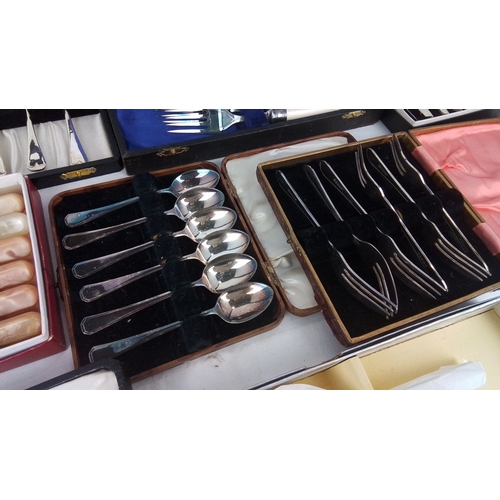 116 - A group of assorted cased flatware including fish knives and forks with ivory-coloured handles, moth... 