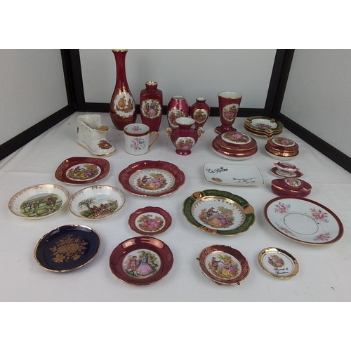 117 - A group of Limoges porcelain table wares and cabinet pieces, various forms in deep claret and polych... 