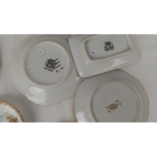 117 - A group of Limoges porcelain table wares and cabinet pieces, various forms in deep claret and polych... 
