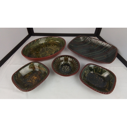 121 - A group of studio pottery bowls and dishes by Brackland Pottery, David Alexander, with red-brown ext... 