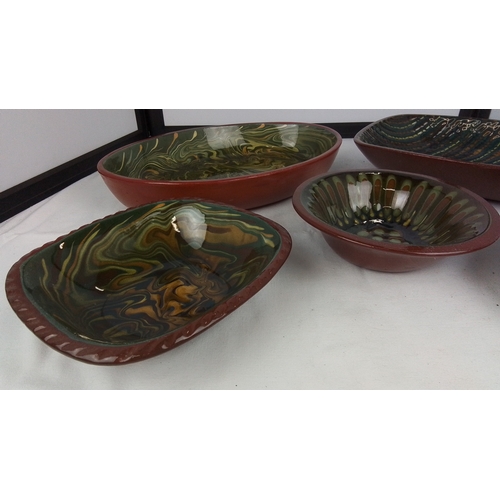 121 - A group of studio pottery bowls and dishes by Brackland Pottery, David Alexander, with red-brown ext... 