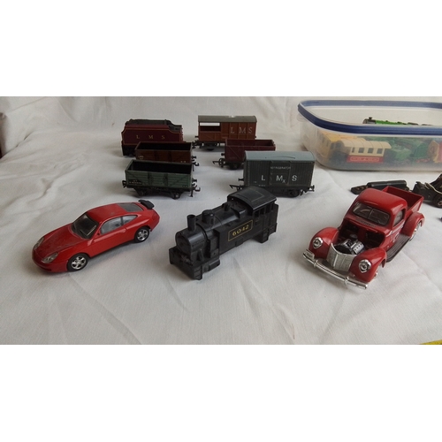 485 - A quantity of vintage toy vehicles and model railway rolling stock, including LMS goods wagons, a bl... 