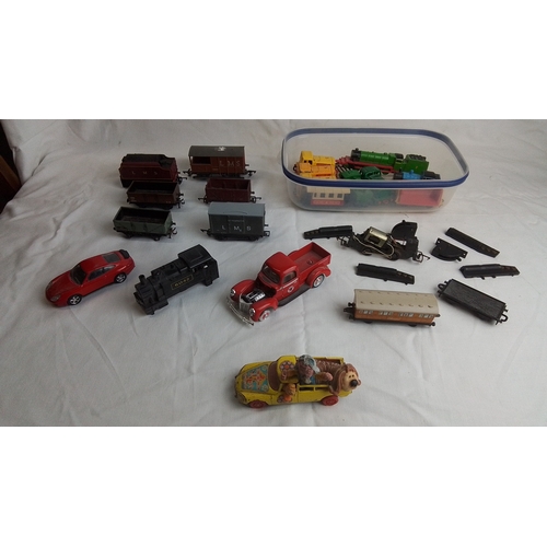 485 - A quantity of vintage toy vehicles and model railway rolling stock, including LMS goods wagons, a bl... 