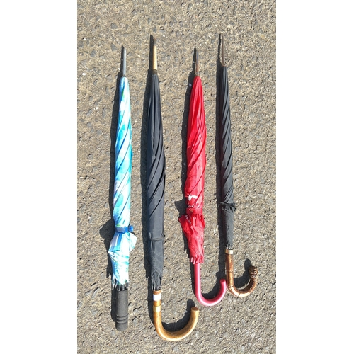 11 - An assortment of 4 umbrellas.