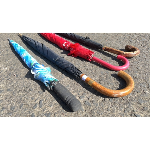 11 - An assortment of 4 umbrellas.