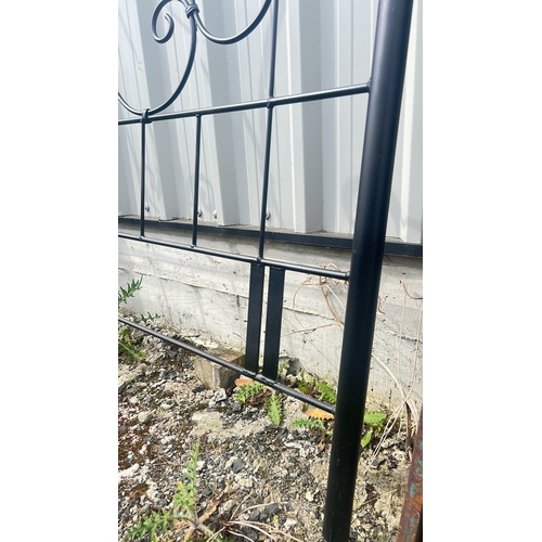 122 - An antique wrought iron headboard, 175cm x 145cm.