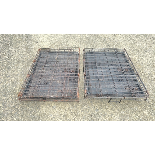 124 - 2 folding dog crates.
