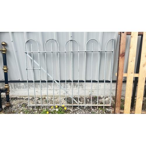 125 - A galvanised steel pedestrian gate with arched loop cresting, 125cm x 150cm.