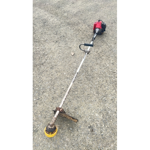 129 - A brushcutter with Marunkaka T140 petrol engine.