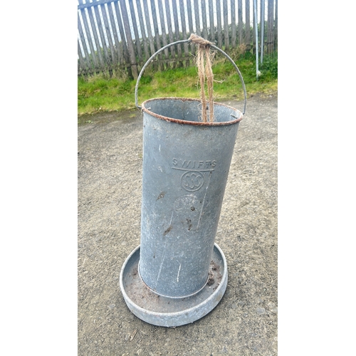 131 - A vintage galvanised metal poultry feeder, embossed 