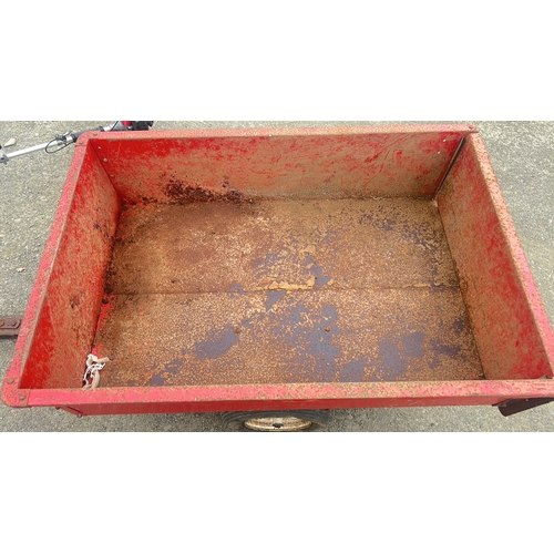 137 - An Agri-Fab 10 cu. ft. steel utility dump cart, red painted, with rectangular open tub, pin-hitch dr... 