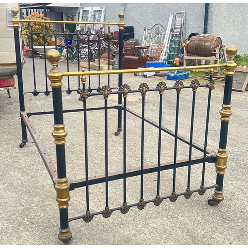 139 - Victorian brass and iron double bedstead, the black-painted end panels with finial-topped uprights a... 