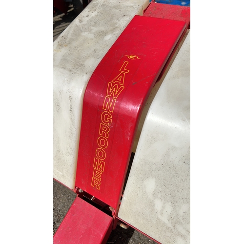 16 - Garden lawn groomer—towed, red-painted steel chassis with twin translucent plastic hoppers, spiked a... 