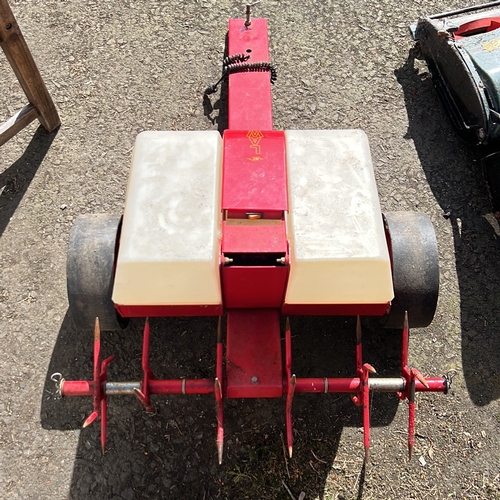 16 - Garden lawn groomer—towed, red-painted steel chassis with twin translucent plastic hoppers, spiked a... 