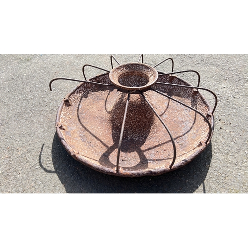 25 - A cast iron 'Mexican Hat' pig trough.