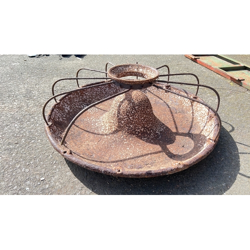 25 - A cast iron 'Mexican Hat' pig trough.