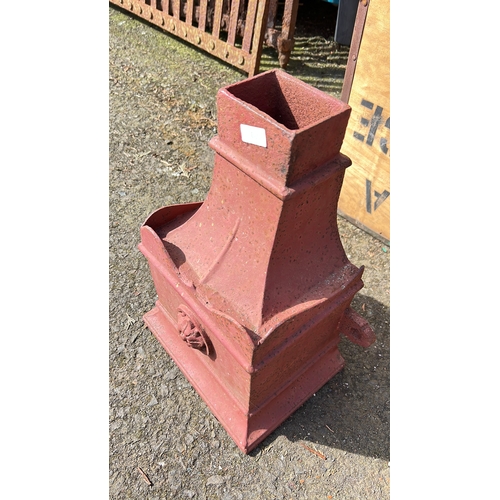 27 - A large antique cast iron rain hooper.