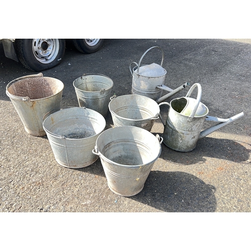 32 - Item 1: galvanised metal watering can, domed lid, top handle. Item 2: galvanised metal watering can,... 