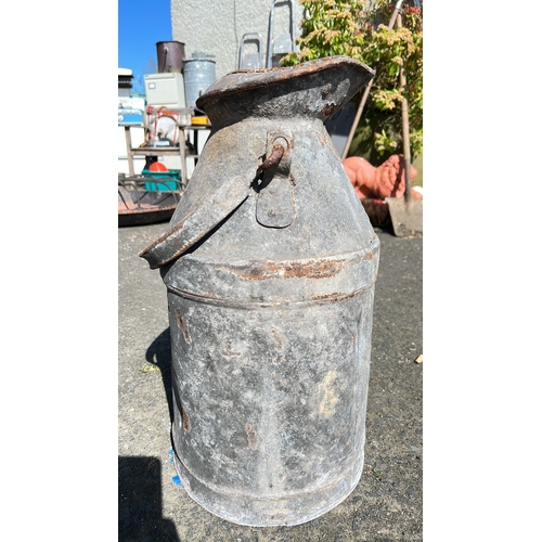 4 - An antique metal creamery can.