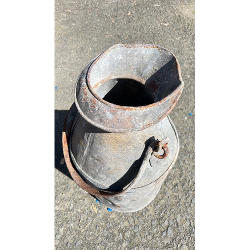 4 - An antique metal creamery can.