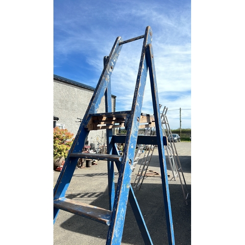 42 - A blue painted hardwood A-frame ladder with stepped treads.