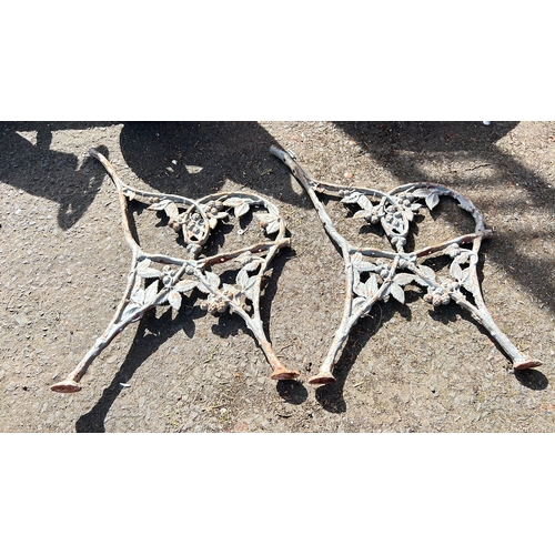47 - A set of decorative antique cast iron bench ends.