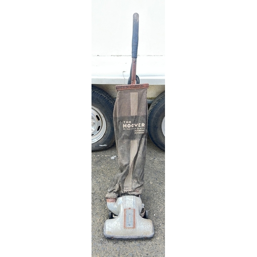 57 - A vintage Hoover upright vacuum cleaner, mid-20th century, with painted metal body, rubber bumper ba... 