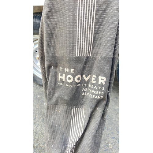 57 - A vintage Hoover upright vacuum cleaner, mid-20th century, with painted metal body, rubber bumper ba... 