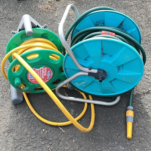 59 - 2 hose reels.