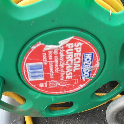 59 - 2 hose reels.